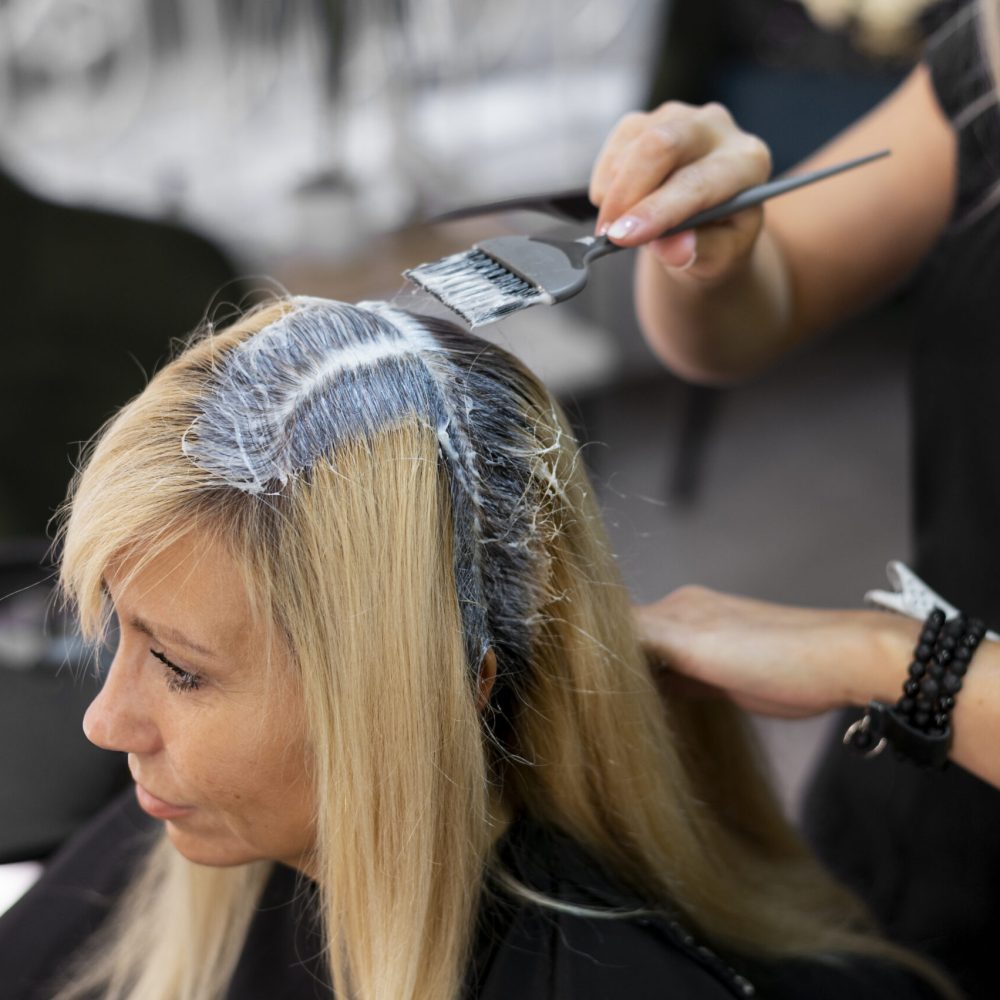 woman-getting-her-hair-dyed-beauty-salon